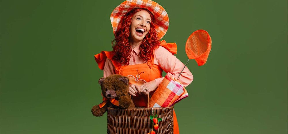 A lady holding a picnic basket