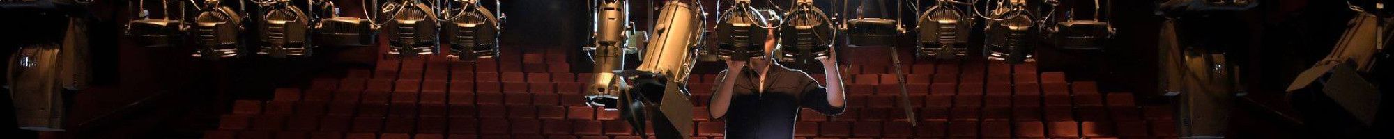 staff member adjusting lights