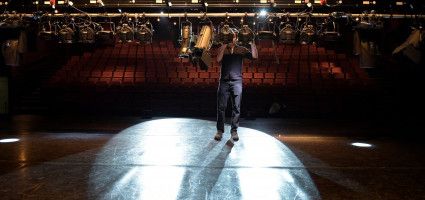 staff member adjusting lights